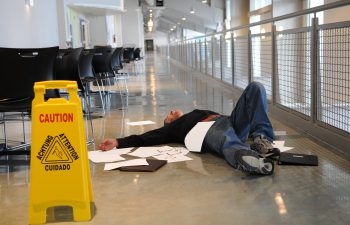 a person who has fallen over on a slippery floor